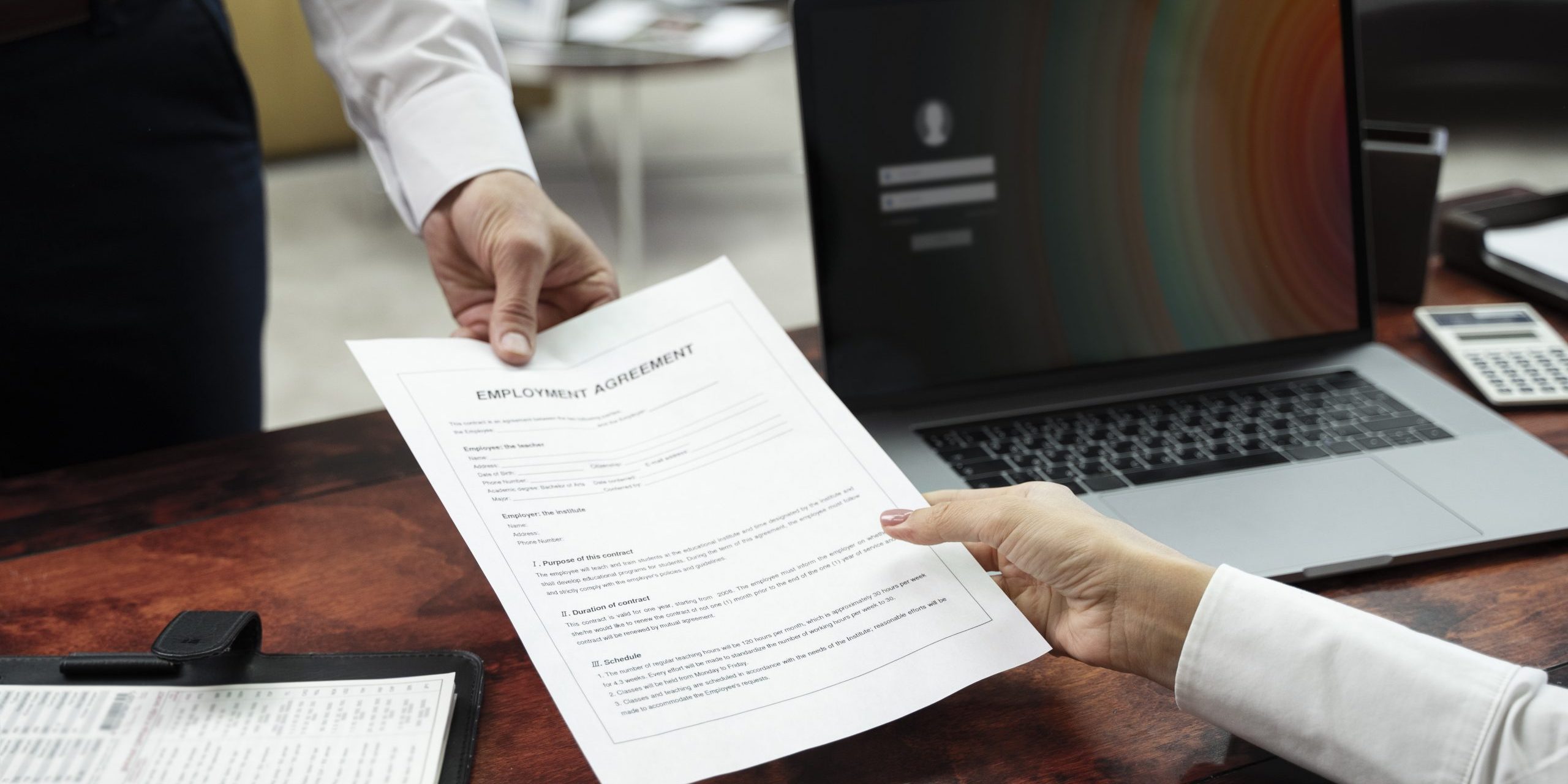 high-angle-hands-holding-document (1)