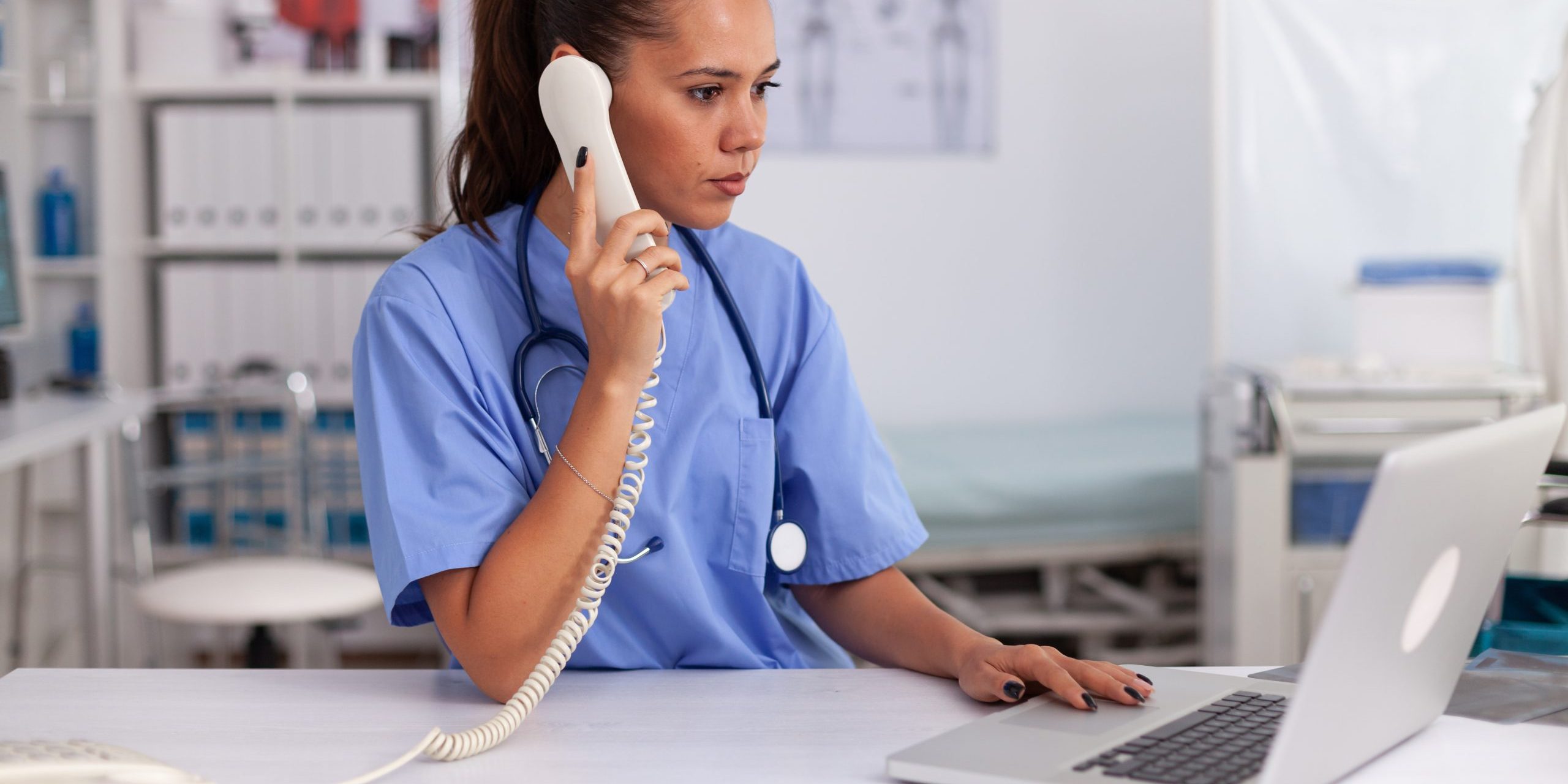 Medical practitioner answering phone calls