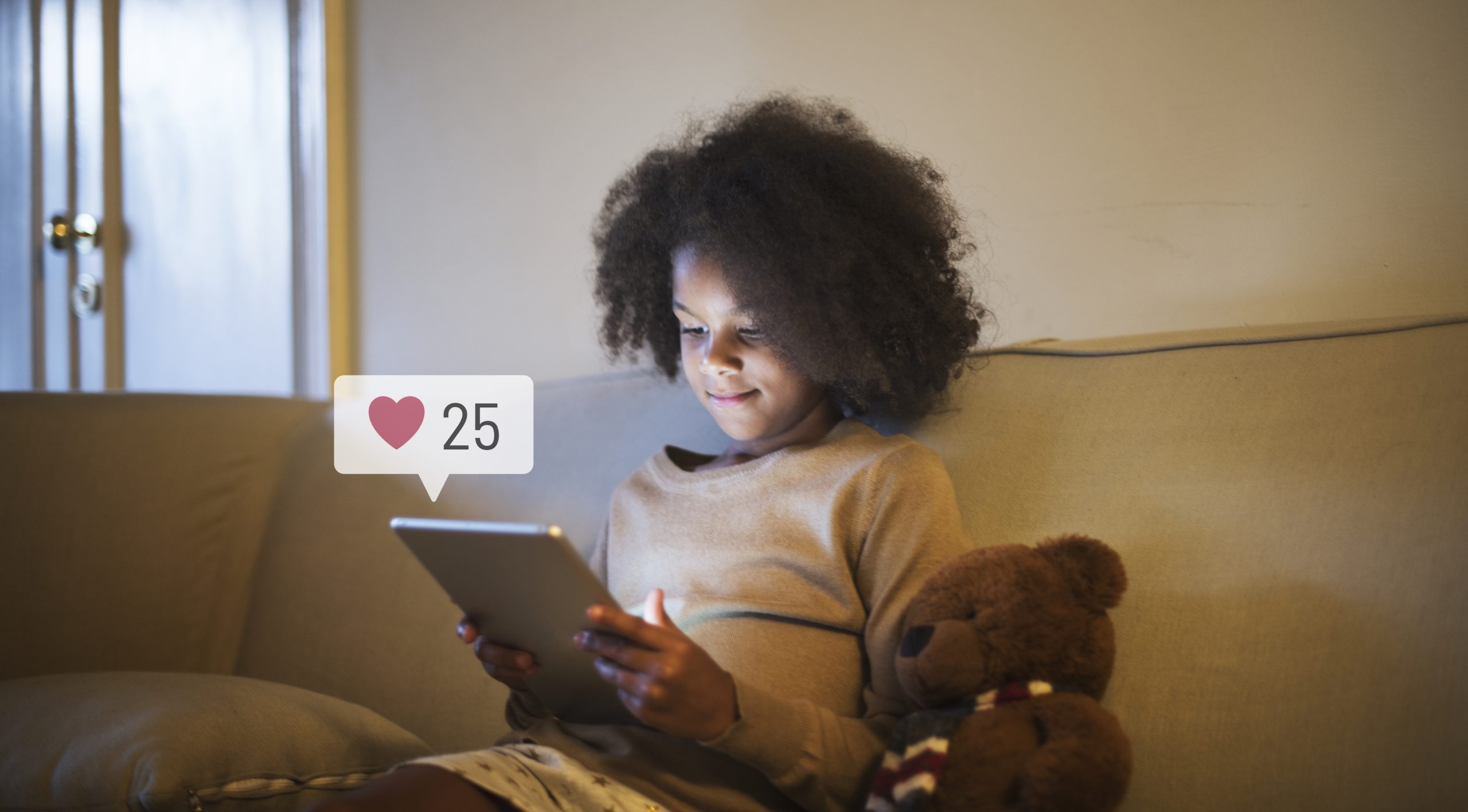 young-girl-using-digital-tablet-before-bedtime